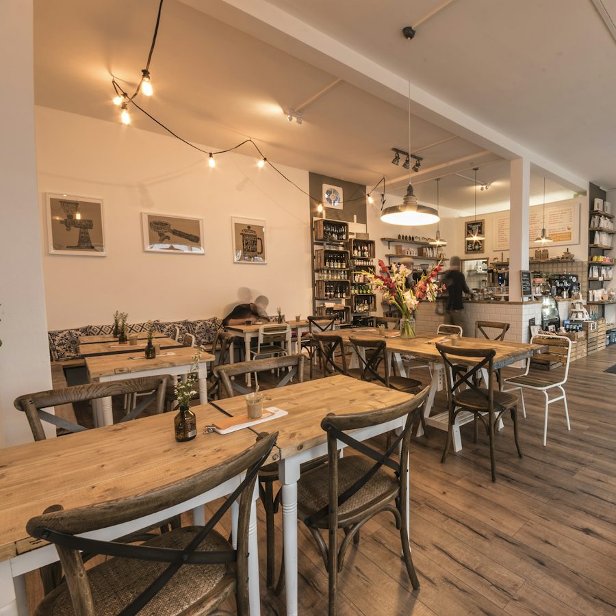 A bright room with wooden tables and chairs