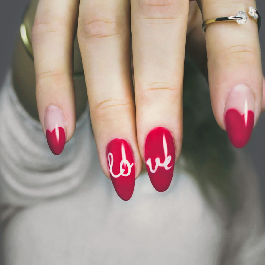 Pink nails with red heart art