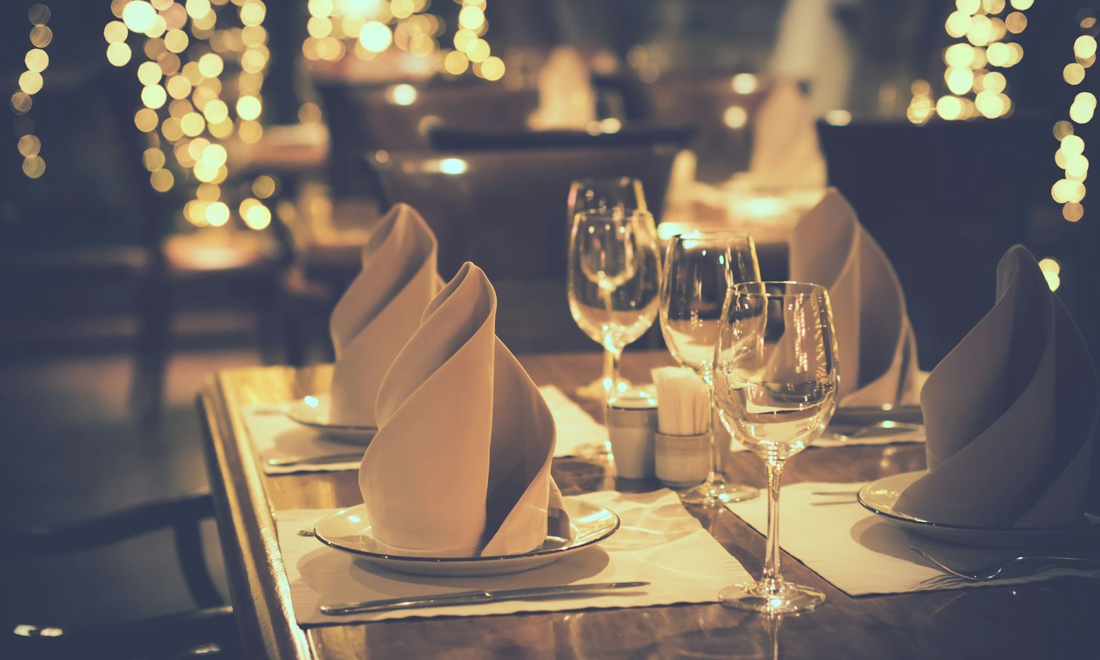 A candlelit table set for dinner