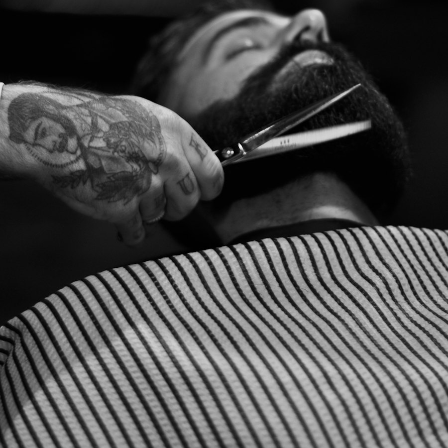 A beard being trimmed with scissors