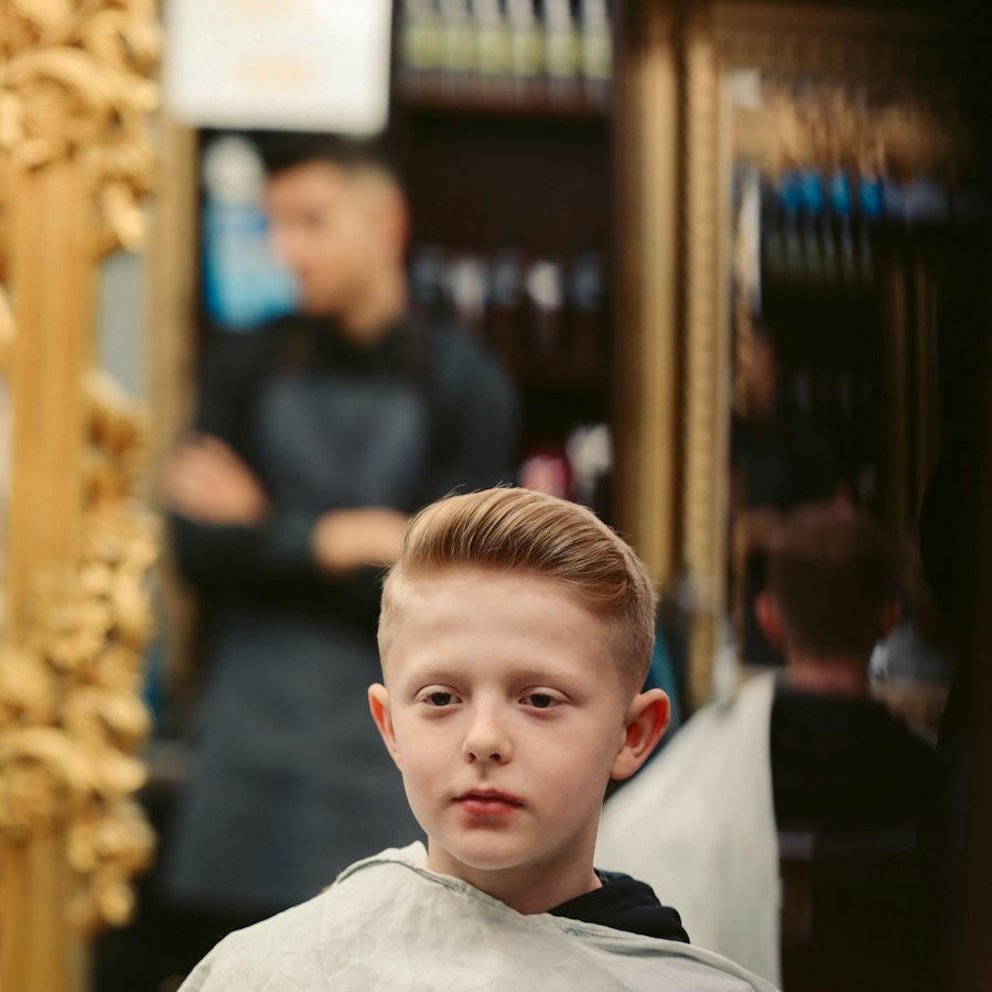A young boy getting his hair cut