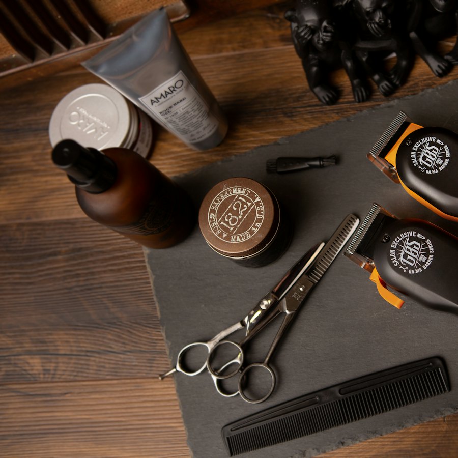 Clippers, scissors and a comb laid out on a board